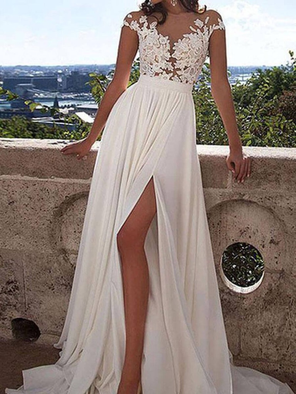 Milla Nova wedding dress with a lace bodice and a flowing skirt